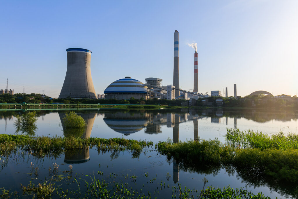 coal fired power plant reflection in a lake industry landscape